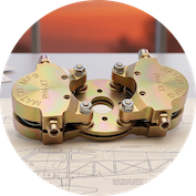 Matco aircraft brake assembly featuring a dual-piston caliper and organic brake pads for experimental planes.